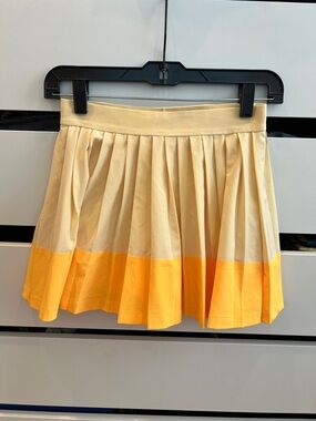 Athleta Cream Pleated Mini Skirt with Yellow Hem